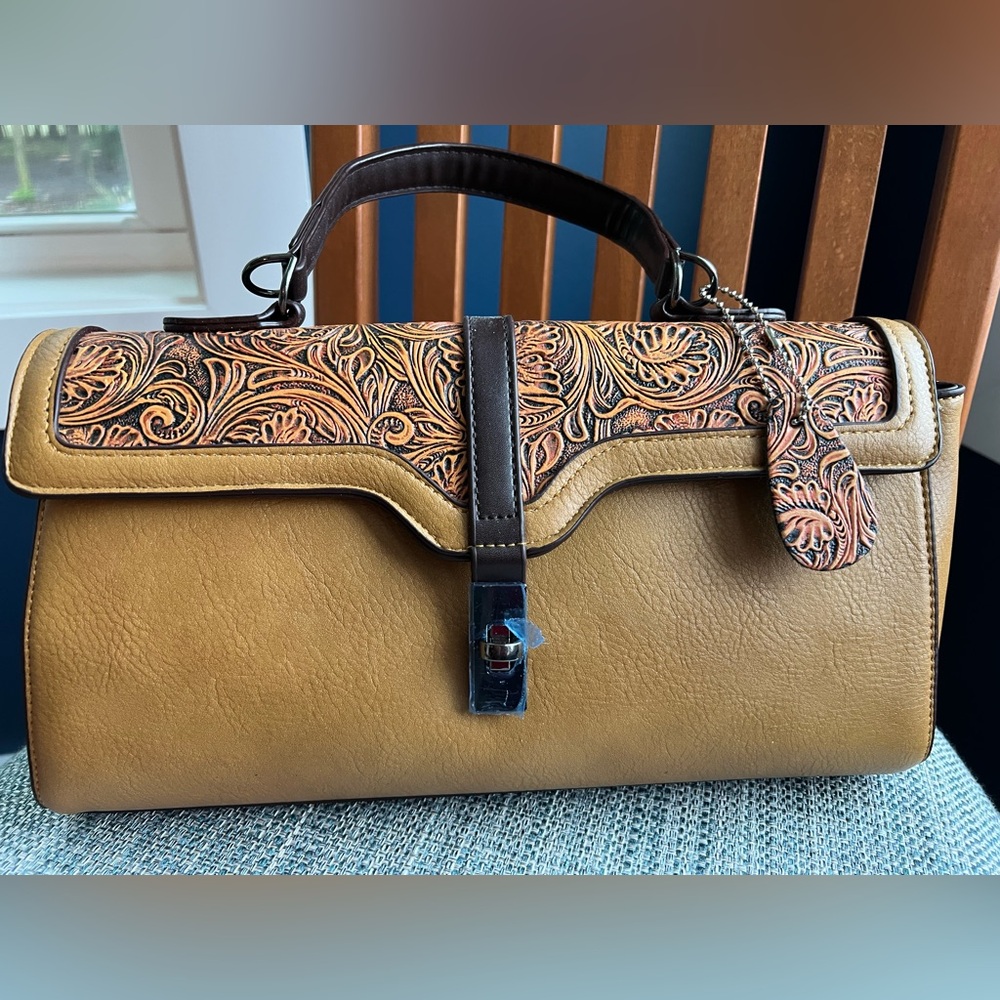 Designer Handbag with adjustable crossbody strap.